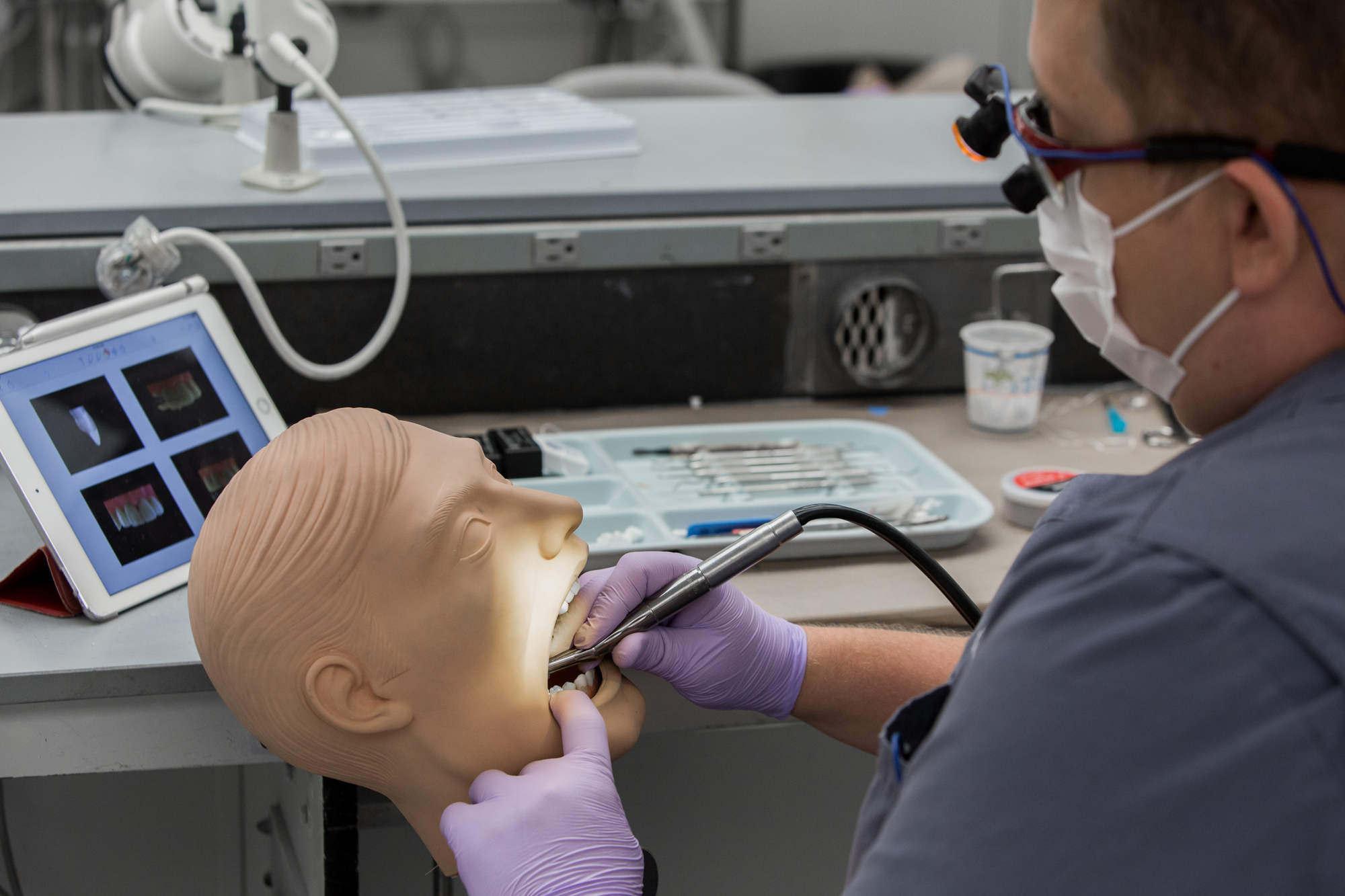 Dental student practicing procedure in skills lab.  